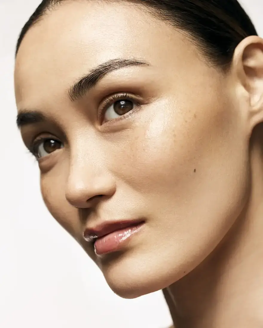 A close portrait of a woman's face and skin
